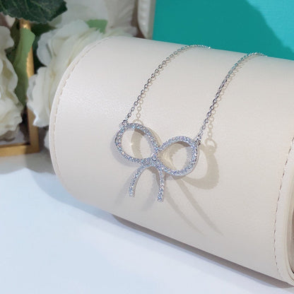 [Lume Jewelry]CLAW SET RHODIUM PLATED BOW NECKLACE